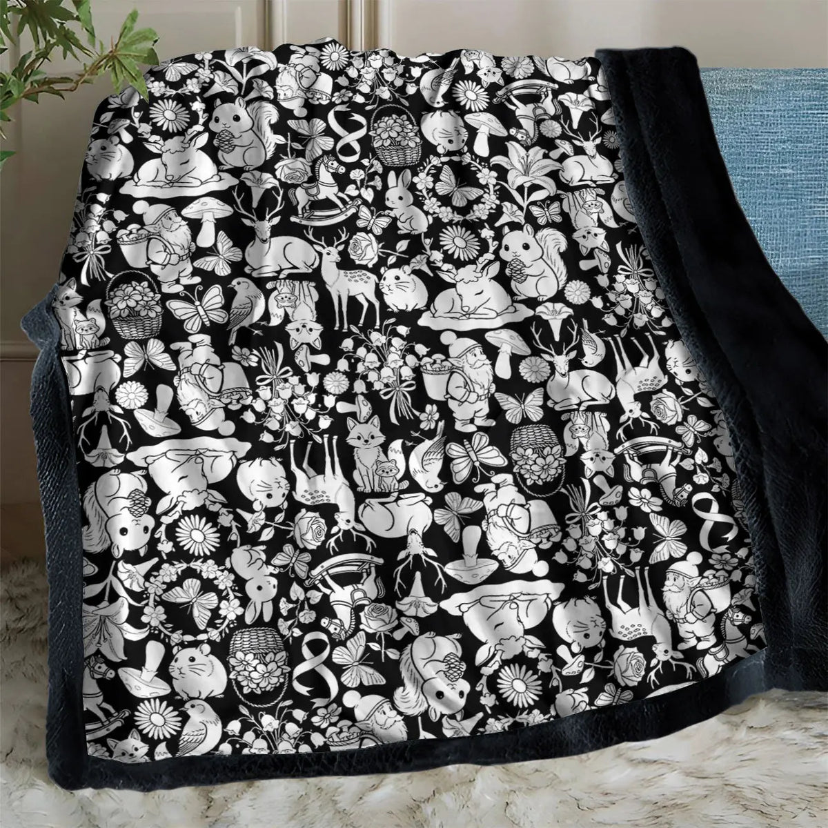 Pintolia Kuscheldecke, Waldtiere-Motiv auf dem Sofa